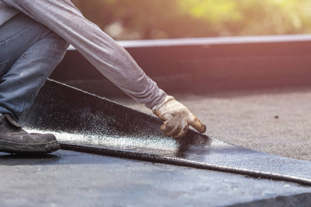 Professional Basement Waterproofing technician working in Trafford, PA